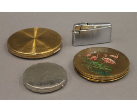 A quantity of vintage compacts and a lighter. The largest 8 cm diameter.