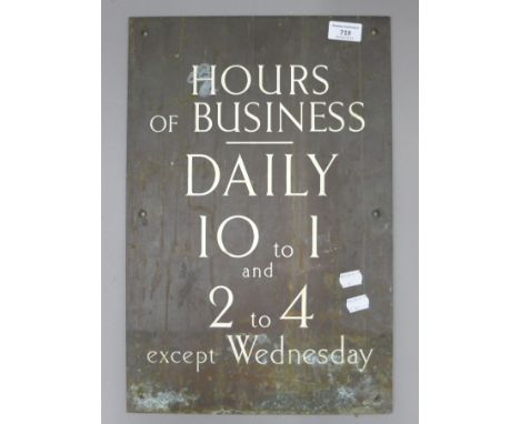 A vintage bronze and enamel sign. 30.5 x 46 cm.