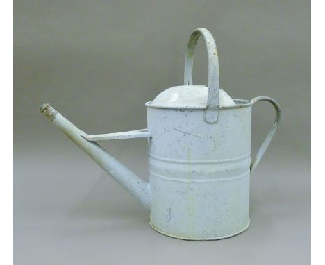 A vintage watering can. 43 cm high.
