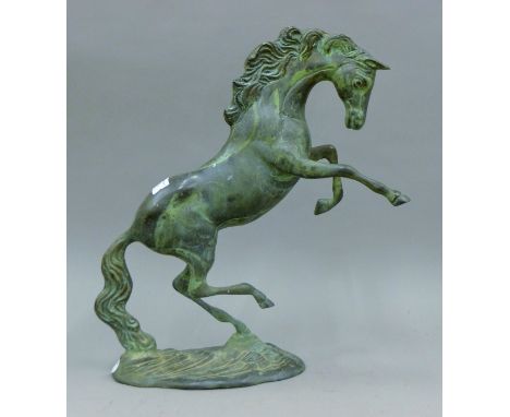 A bronze model of a rearing horse. 38 cm high.