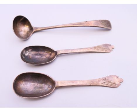 A pair of silver spoons and a small silver ladle.  Spoons each 10 cm long. 39.4 grammes. 