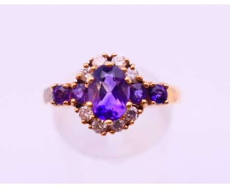 A 9 ct gold, diamond and amethyst ring. Ring size S.