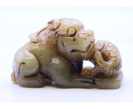 A jade dog-of-fo with a fish.  6 cm wide, 3.5 cm high. 