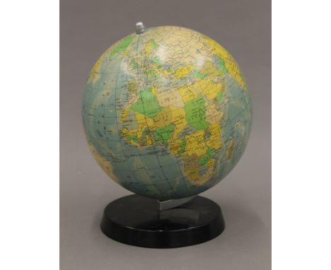 A vintage desktop globe. 26 cm high.