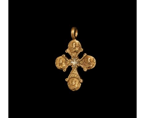 5th-7th century AD. A heavy gold pendant cross with a quatrefoil centre inset with iridescent glass paste, each arm formed as