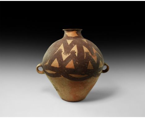 Majiayao Culture, 3300-2000 BC. A ceramic jar with flaring rim and short neck, globular body with painted decoration of round