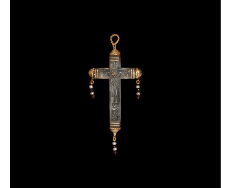 17th-18th century AD. A carved rock crystal cross pendant with silver-gilt bands to the arms and domed finials each with a ro