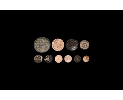 Mainly 4th-2nd millennium BC. A mixed group of stone plano-convex stamp seals, discoid in plan, including five accompanied by