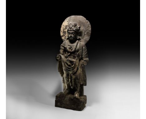 2nd-3rd century AD. A carved slate statue of a bodhisattva (perhaps Avalokiteshvara) standing nimbate with draped clothing an