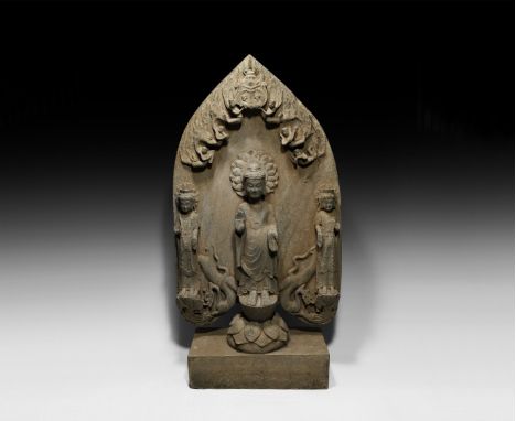 Eastern Wei, 6th century AD.&nbsp;A carved sandstone architectural panel comprising an aureole with flying deva figures to th