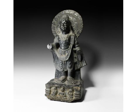 Kashmir, 6th century AD.&nbsp;A powerful schist figure of a bodhisattva, possibly bodhisattva Maitreya, standing on a rectang