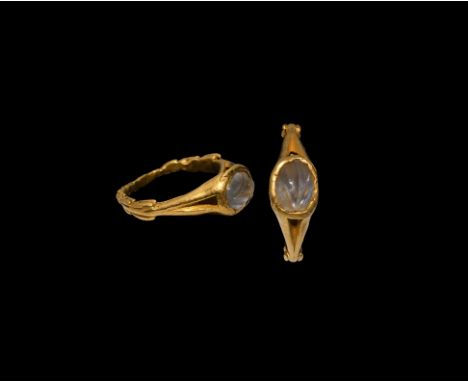 Late 3rd-early 4th century AD. An unusual gold ring with the lower part of the hoop formed as a wreath, angled shoulders exte