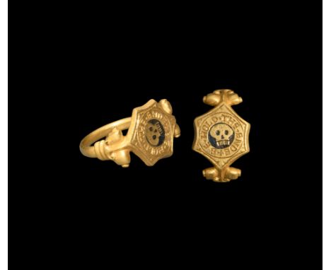 Late 16th century AD. A substantial gold ring with D-section hoop, scrolled capital with volute scroll to each shoulder, hexa