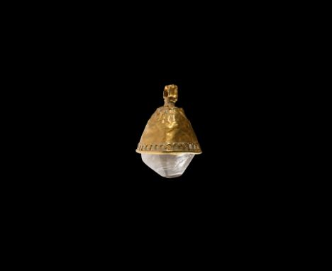9th-12th century AD. A conical sheet gold pendant cell with suspension loop and filigree annulets, rolled rim, rock crystal i