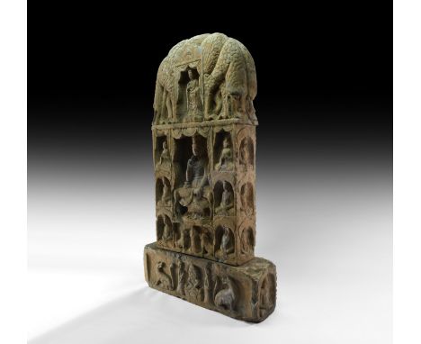 Northern Qi Dynasty, 5th-6th century AD.&nbsp;An imposing carved fossiliferous limestone stele surmounted by four entwined gr