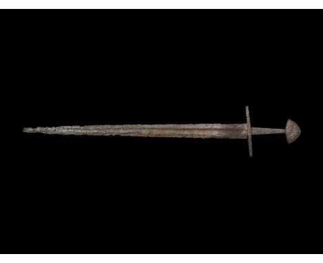 Mid 12th-mid 13th century AD. An iron double-edged long sword of Oakeshott Type Xa and Petersen Type X with pattern-welded bl