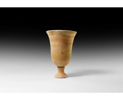 New Kingdom, 1550-1070 BC. A carved alabaster chalice with trumpet-shaped foot and bell-shaped body.  464 grams, 15cm (6"). P