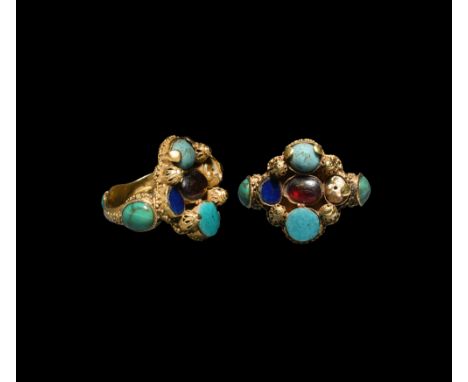 14th century AD. A gold finger ring with granulation to the hoop, three radiating cells each with an turquoise cabochon, quat