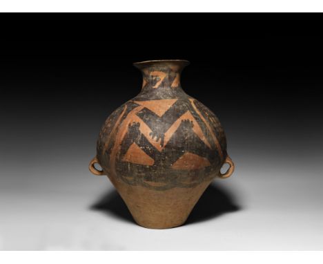 Majiayao Culture, 3300-2000 BC. A ceramic jar with trumpet mouth, globular body with painted decoration of roundels to the sh