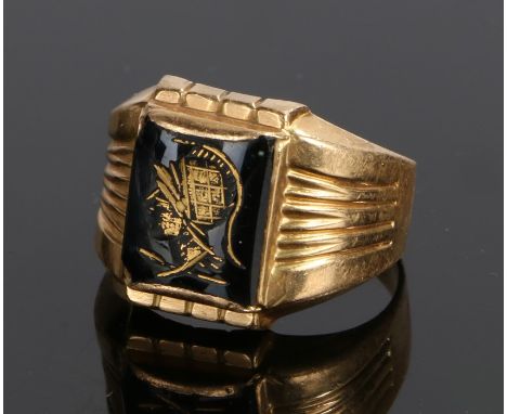 18 carat gold ring, with a classical figure to the head, 5.4 grams, ring size U