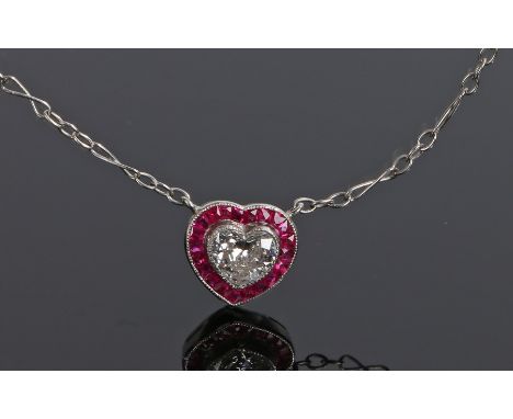 Diamond and ruby set pendant necklace, the heart cut diamond with a ruby surround, 9mm diameter 