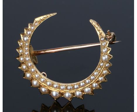 19th Century yellow metal and pearl set crescent brooch, set with two rows of pearls, 32mm high