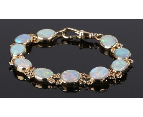 9 carat gold braclet with ten oval opal panels, 12g