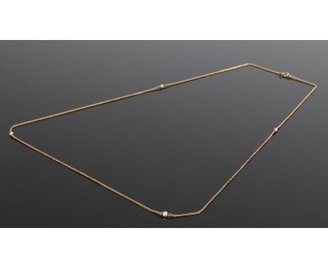 15 carat gold pearl set necklace, with four pearls to the chain, 4.8 grams, 76cm long