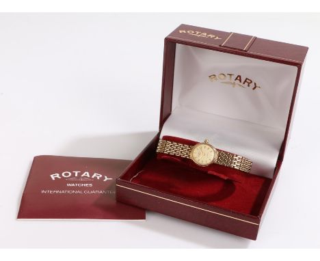 Rotary 9 carat gold ladies wristwatch, the signed champagne dial with baton hours, 9 carat gold attached strap, the case 15mm