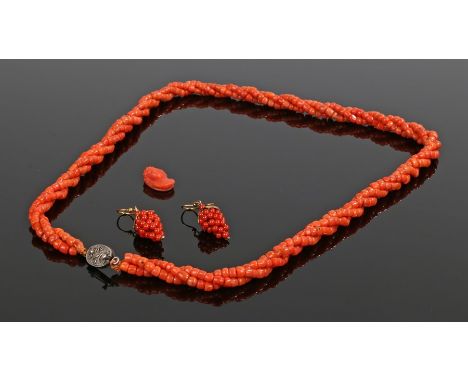 Coral three strand necklace with silver clasp, pair of coral earrings in the form of bunches of grapes, carved coral profile 