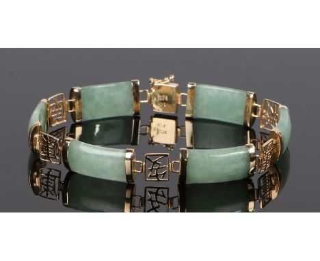 Chinese 14 carat gold and jade bracelet, formed from six jade panels interspersed with pierced Chinese characters, 11.3g