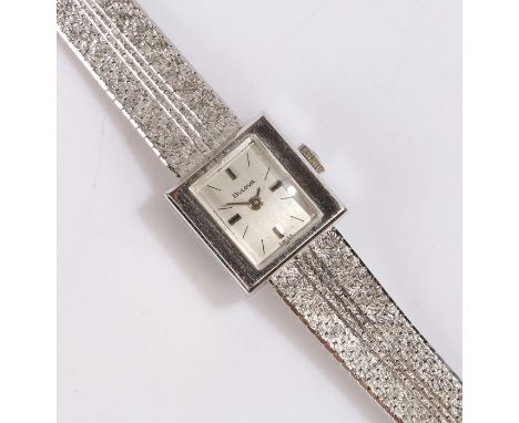 Bulova 14 carat white gold ladies wristwatch, the signed silver dial with baton markers, manual wound, the case 15mm wide, on