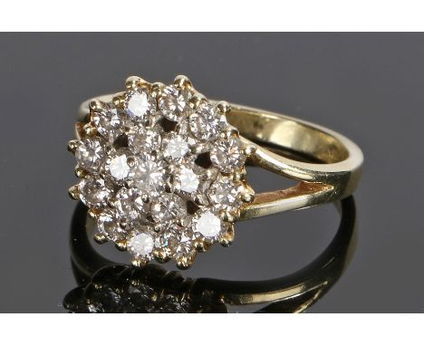 14 carat gold diamond set cluster ring, with one carat of diamonds set to the flower head, ring size M