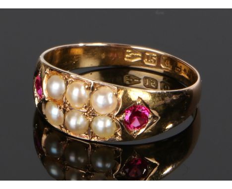 Antique 15 carat gold pearl and ruby ring, the two rows of three pearls flanked by a ruby to each shoulder, with Chester mark