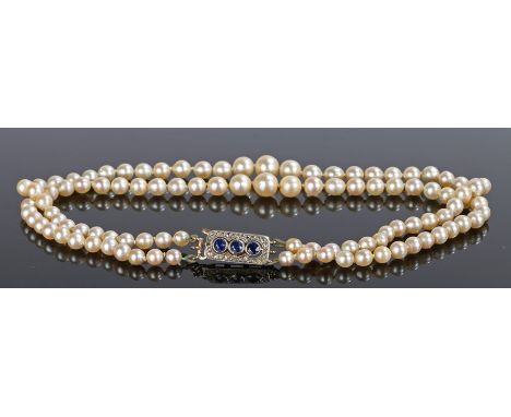 Pearl, Sapphire and diamond necklace, with a double row of graduated pearls attached to the sapphire and diamond set clasp, 3