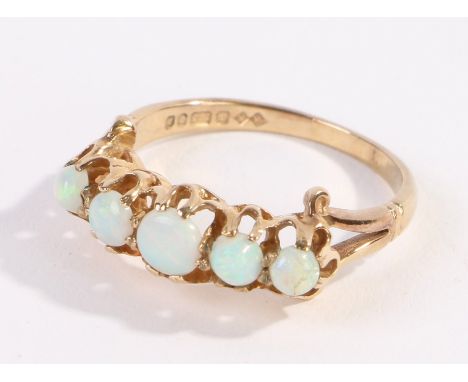 9 carat gold opal set ring, with five opals to the head, ring size R