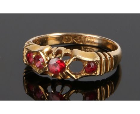 18 carat gold and ruby set ring, the head with four rubies, one stone missing, ring size H