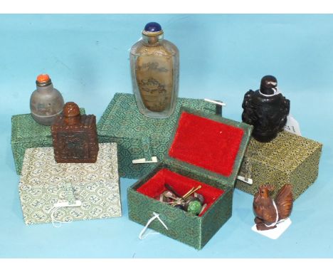 Four Chinese snuff bottles, all boxed, two with internal decoration, one faux horn and one faux amber, a box of snuff bottle 