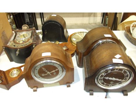 An Enfield oak-cased chiming mantel clock, three oak case striking mantel clocks, a reproduction barometer by Comitti, 97cm a