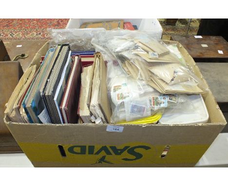 A quantity of postage stamps in albums, loose and First Day Covers.
