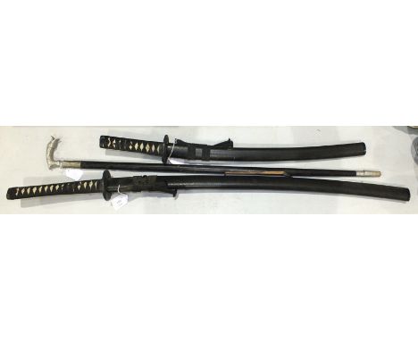 Two reproduction Japanese swords, in scabbards and a stained wood clock, (3).