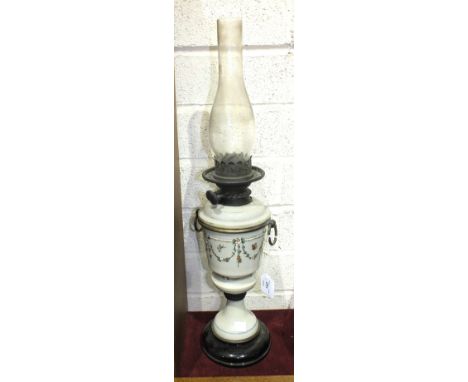 A Late-Victorian opaque glass oil lamp with floral and butterfly decoration, 65cm high overall.