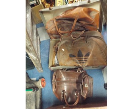 A Vintage Suitcase Containing Holdall Bags