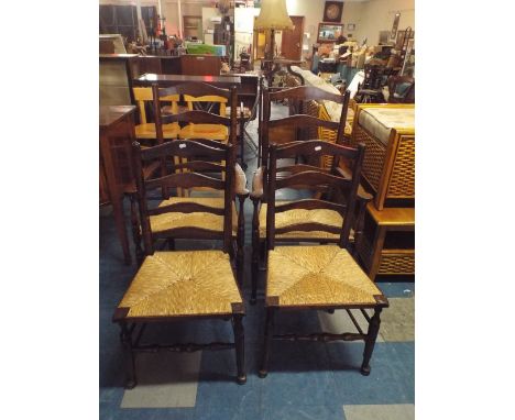 A Set of Four Rush Seated Ladder Back Dining Chairs Including Two Carvers