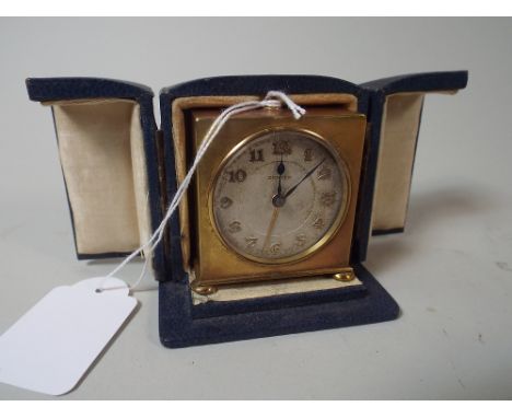 A Cased Brass Zenith Travel Alarm Clock, No. 88445, 6cm high 