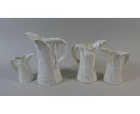 A Collection of Four Graduated Royal Worcester Creamware Jugs, af
