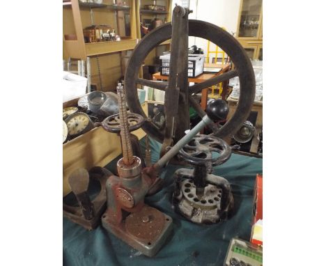 A Collection of Metal Tools to Include Foot Operated Pulley, Clock Makers Presses, Shoe Last Etc
