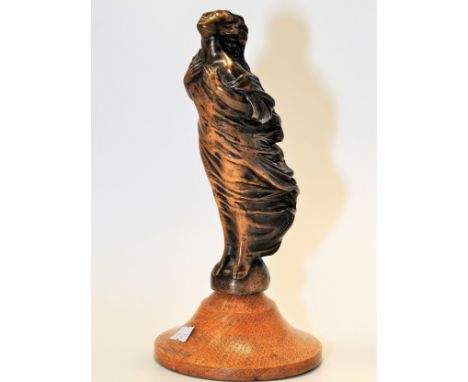 AN EARLY CAR MASCOT 'BRONZE' OF LADY STANDING IN THE WIND ON AN OAK BASE 9 " HIGH (INC BASE) 