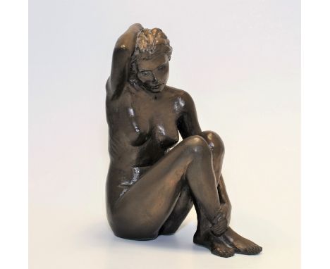 T.L. GREENSHIELDS (1915 - 1994) A MODEL OF A SEATED FEMALE NUDE, LEGS CROSSED HOLDING HAIR 6 1/2" HIGH, RESIN BRONZE ROSIE 
