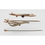 A vintage seed pearl and yellow metal brooch, a 9 carat gold and red stone brooch and part tie pin.